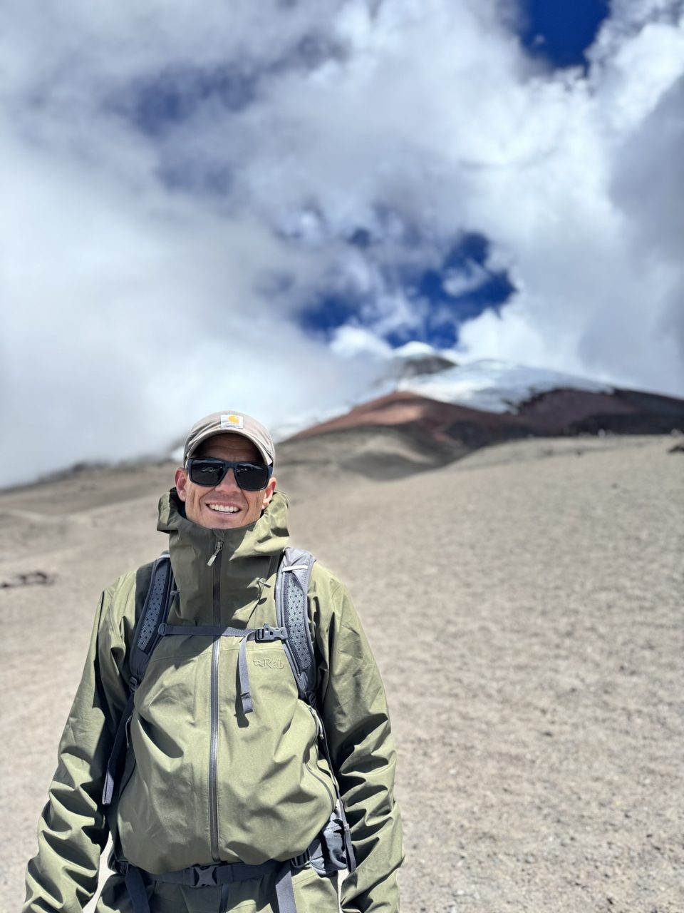 John Bishoff hiking on a high mountain trail